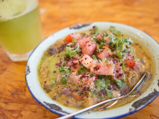 traditional arabic cuisine; hummus,  foul, and mint juice on the table of the restaurant in capital amman