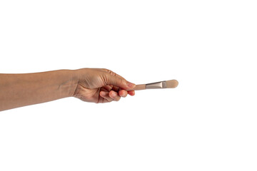 Cosmetic brushes in hand on transparent background. Set of makeup brushes