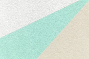 Fototapeta premium Texture of old craft light cyan, beige and white color paper background, macro. Vintage abstract cardboard