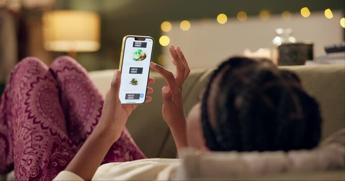 Black woman, sofa and phone screen for food delivery app with choice, menu and ecommerce at night in home. Girl, person and smartphone with click, scroll and decision for diet, nutrition or take away