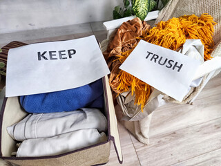 Decluttering Essentials Using the KonMari Method. Assorted items sorted into categories labeled Keep, Trash, and Donate