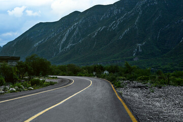 Fototapeta premium Empty asphalt road in mountains. Picturesque landscape