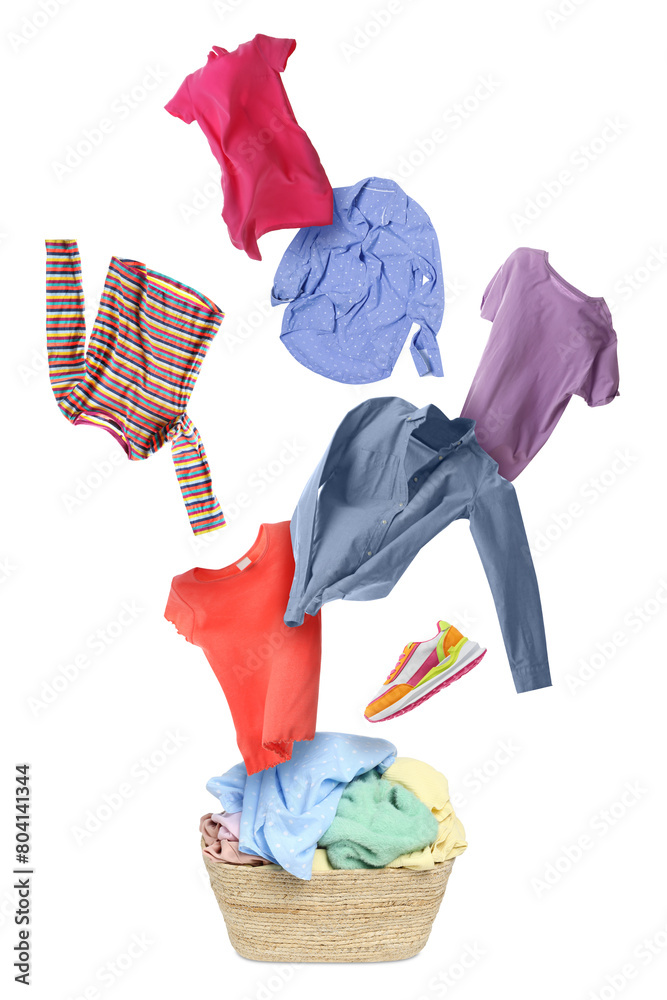 Sticker Clothes in air over laundry basket on white background