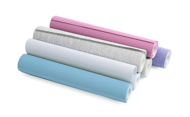 Different colorful wallpaper rolls isolated on white