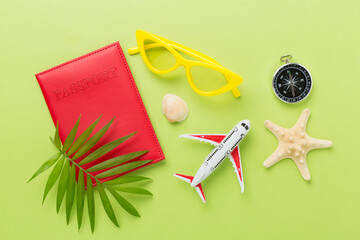 Bright flat lay with travel accessories on color background, top view