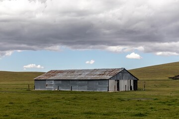 Fototapeta na wymiar Ranch shed on farmland in rural Santa Margarita, California, United States of America.