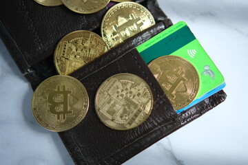 wallet with credit debit card and crypto currency bitcoin golden coin 