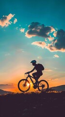 Obraz premium A man is riding a bike in a beautiful sunset