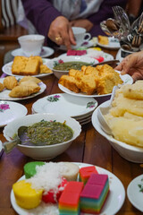 A spread of food served for guest in a Malay house.