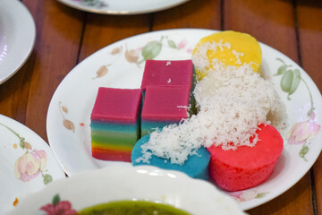 Malaysian cakes or kuih-muih on selective focus and blurry.