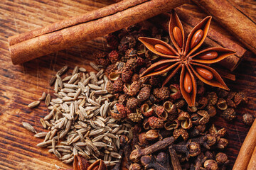 aromatic Chinese five spices on a dark rustic background