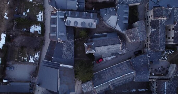 Aerial top view of Anciles, showcasing its iconic Pyrenean architecture at dusk, Spain