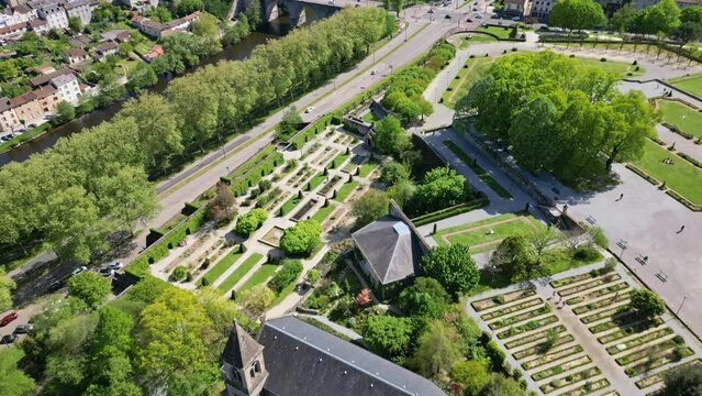Botanical garden of bishopric and Pont Neuf bridge, Limoges in France. Aerial top-down forward