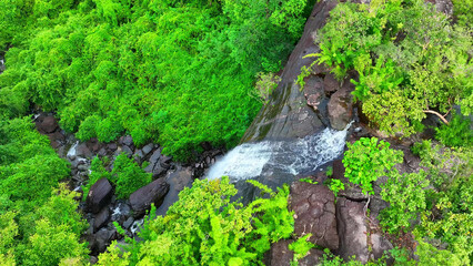Pha Luang Waterfall is a mesmerizing natural wonder, nestled in lush greenery. Its cascading waters, serene ambiance, and vibrant flora make it a must-visit destination for nature enthusiasts. 
