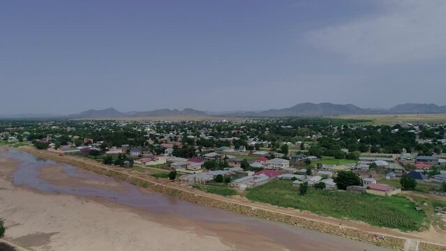 A drone shot of Maroua town in Cameroon with Maroua River in view.