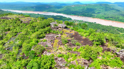 Pha Taem cliffs overlooking the majestic Mekong River, a breathtaking natural wonder from a bird's...