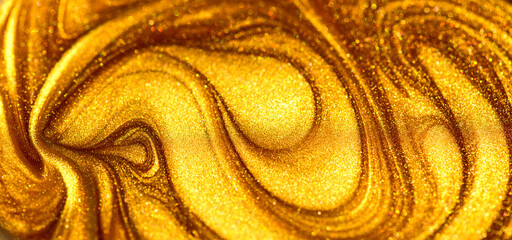 Beautiful abstract golden liquid paint background, beauty gold backdrop texture. Metallic gold paint, art design. Yellow shimmering surface close-up. Golden bright glitter texture, macro shot 