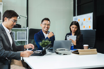 Asian business people working as a good team in the office. Successful teamwork in a meeting, workplace concept.