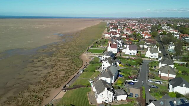 Hoylake Beachfront conservation area - aerial drone flyover towards meols, highlighting Spartina grass, Wirral UK