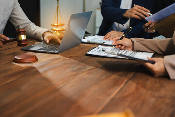 Business people and lawyers discussing contract papers sitting in the table at office in the morning. concepts of law, advice, legal services.