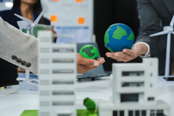 Businessman team brainstorming using tablet, laptop computer for working technology and business,  Renewable energy-based green businesses and global warming. Reduce CO2 emission.