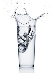 Water splash with ice cube in a glass isolated on white background