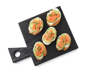 Tasty canapes with salmon, cucumber and cream cheese isolated on white, top view