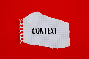 Context word written on ripped white paper piece with red background. Conceptual context symbol. Copy space.