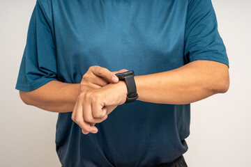 Senior old man wearing sportswear using Smart Watch Showing Heart Rate Monitor on isolated...