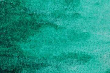 Abstract green watercolor painting as background, top view