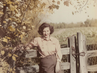 Vintage Portrait of Smiling Woman at Fence