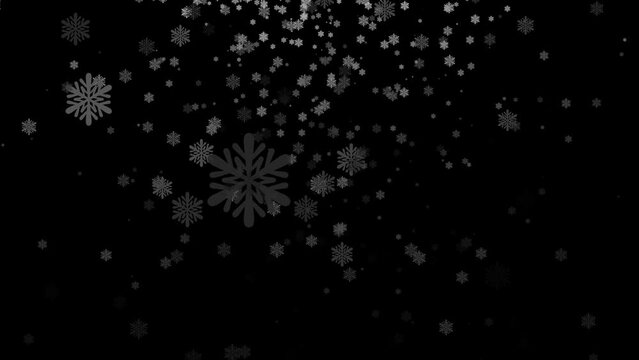 The tranquility of snowflakes against a dark sky is perfect for conveying the serene beauty of winter.