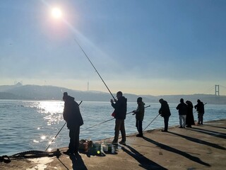 fishing at sunset