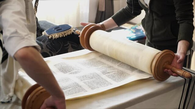 Hand of young boy reading the Jewish Torah at Bar Mitzvah Bar Mitzvah Torah