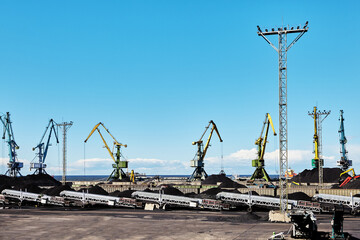 Mobile stacker radial telescopic conveyors in coal harbor of ocean terminal.