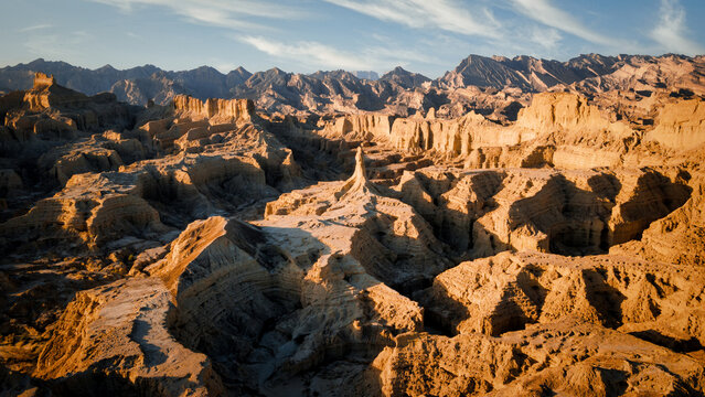 Rugged eroded badlands with sharp ridges and deep gullies