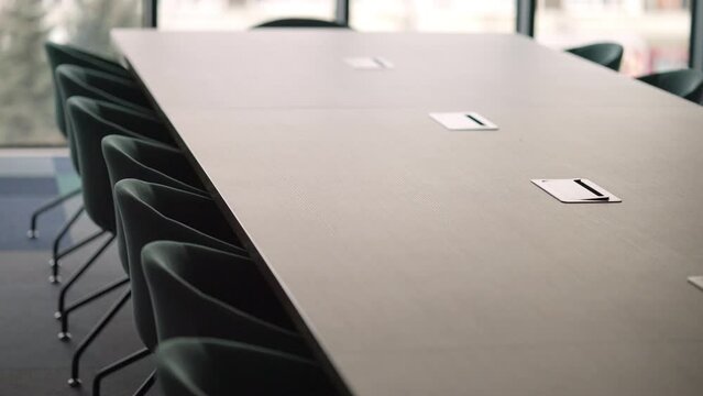 Empty Modern Chairs by a Conference Table in a Boardroom. Concept of Business