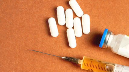 Top view of syringe and powdered medicine. Doping for an athlete. Concept of doping products and...