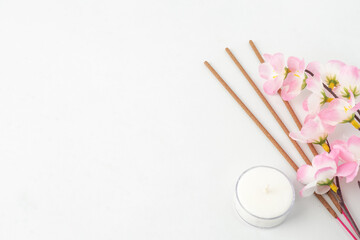 Isolated Empty white background decorated with colorful flowers, red colored incense and round...