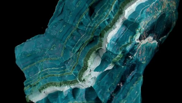 Chrysocolla [copper silicate hydroxide] banded with layers of malachite and gem silica, rotating slowly
