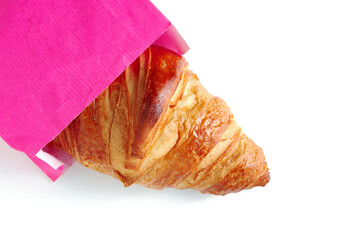 Croissant in a paper bag