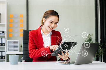 businesswoman hand working with mobile phone and modern compute with VR icon