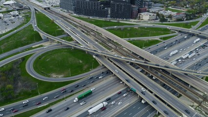 Dense traffic flows on urban road network, aerial capture shows non-stop pulse of metropolitan...