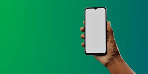 African-American hand with smartphone against green; great for app showcases