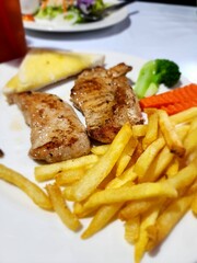 Pork steak and salad