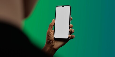 African-American hand with smartphone against green; great for app showcases