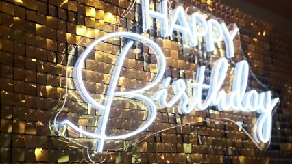 Golden shaking background from a lot of reflecting parts Happy Birthday Celebration neon light Message Video with oskar statue dummy