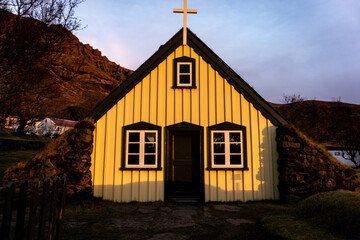 Hofskirkja turf church in Hof at sunset in Vatnajokull national park Iceland