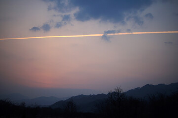 contrail at dusk