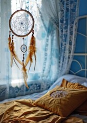 A dreamcatcher hanging in a bedroom window.